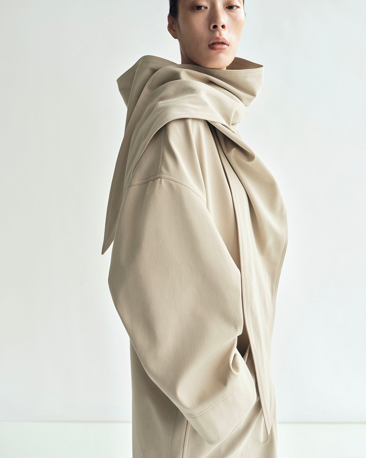 lookbook image of model wearing gesse coat in cotton twill in khaki