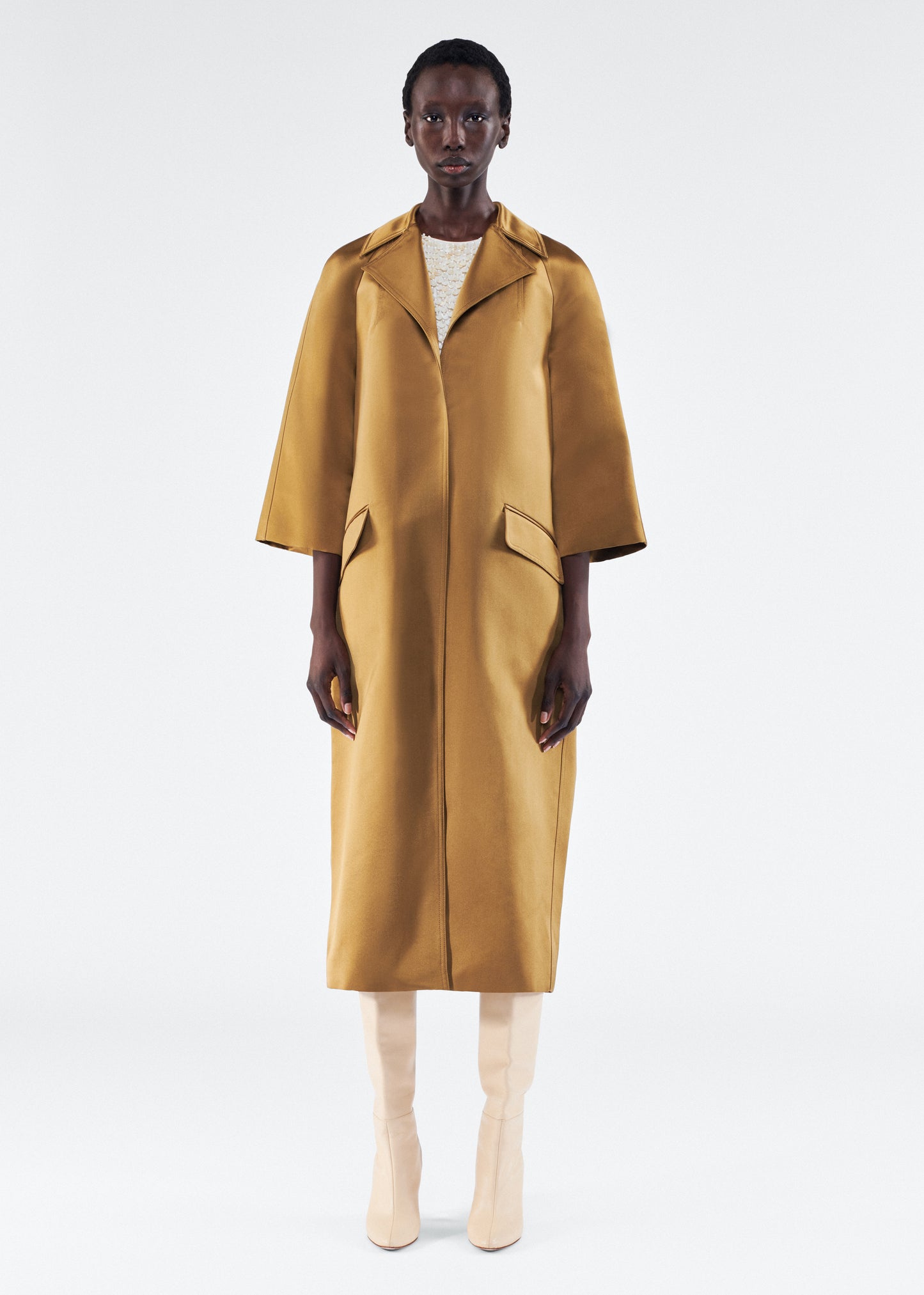 Model is wearing Opera Coat in Duchess Satin in Bronze