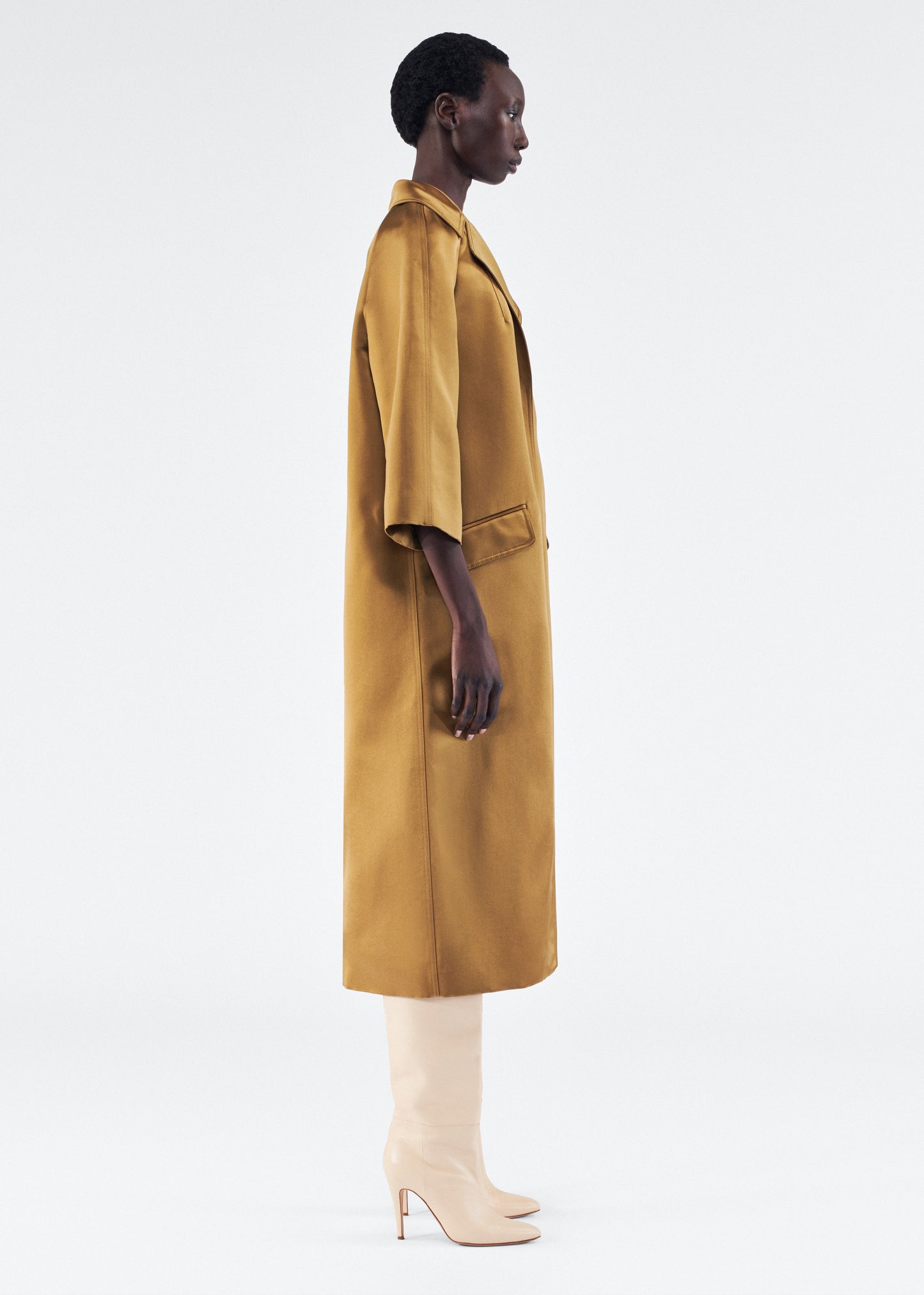 Model is wearing Opera Coat in Duchess Satin in Bronze