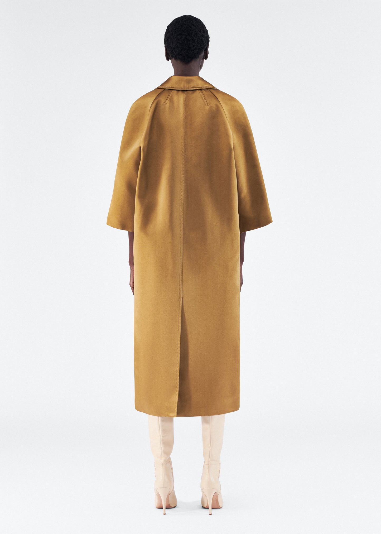 Model is wearing Opera Coat in Duchess Satin in Bronze