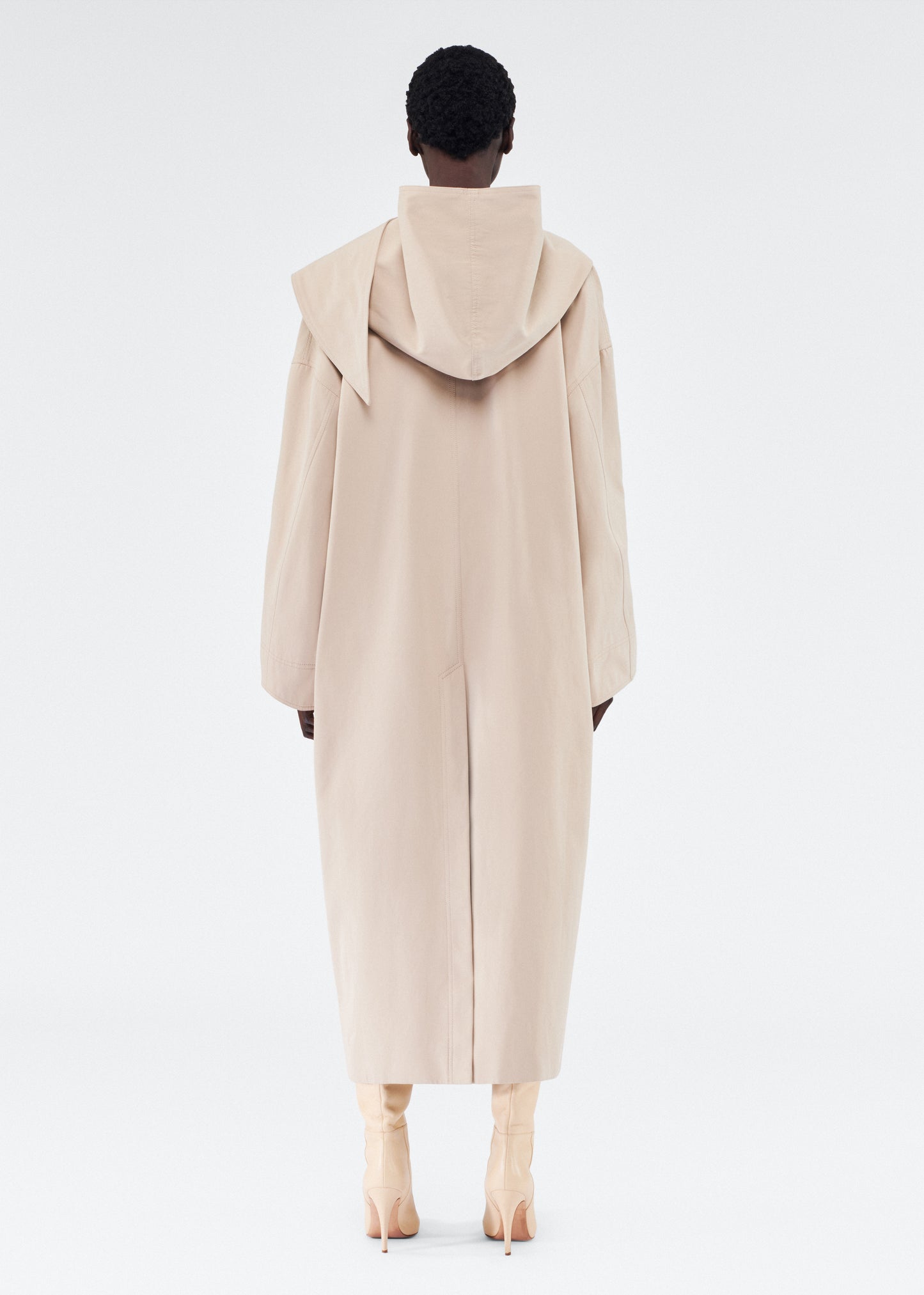 back view of model wearing gesse coat by adam lippes in cotton twill in khaki