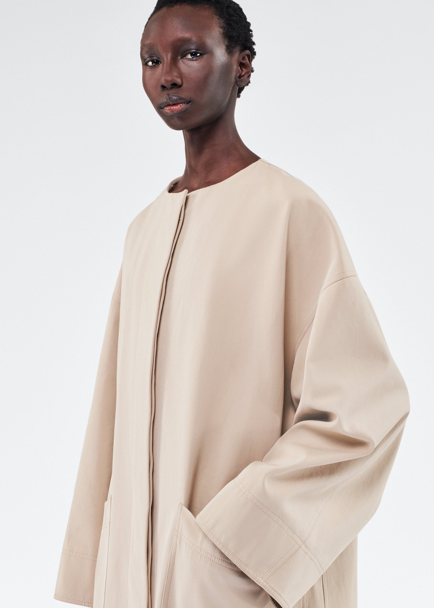 model wearing gesse coat by adam lippes in cotton twill in khaki