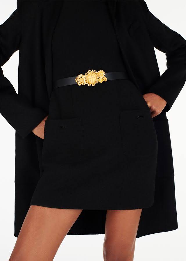 model wearing the gold floral garland belt by Adam Lippes