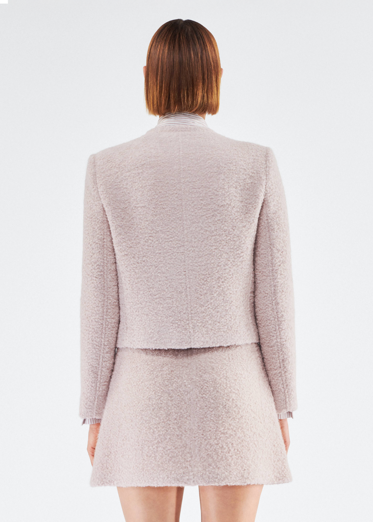 Back of model wearing the Lana Jacket in Brushed Boucle in Blush