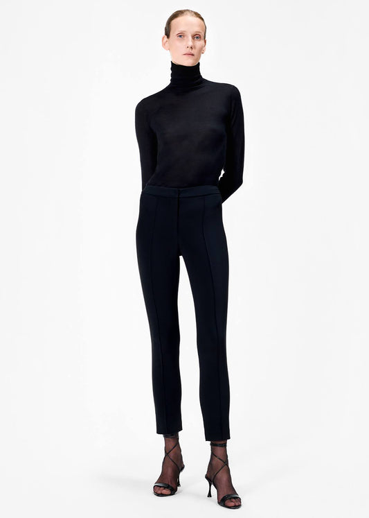 model wearing the cigarette pant in stretch cady in black by Adam Lippes
