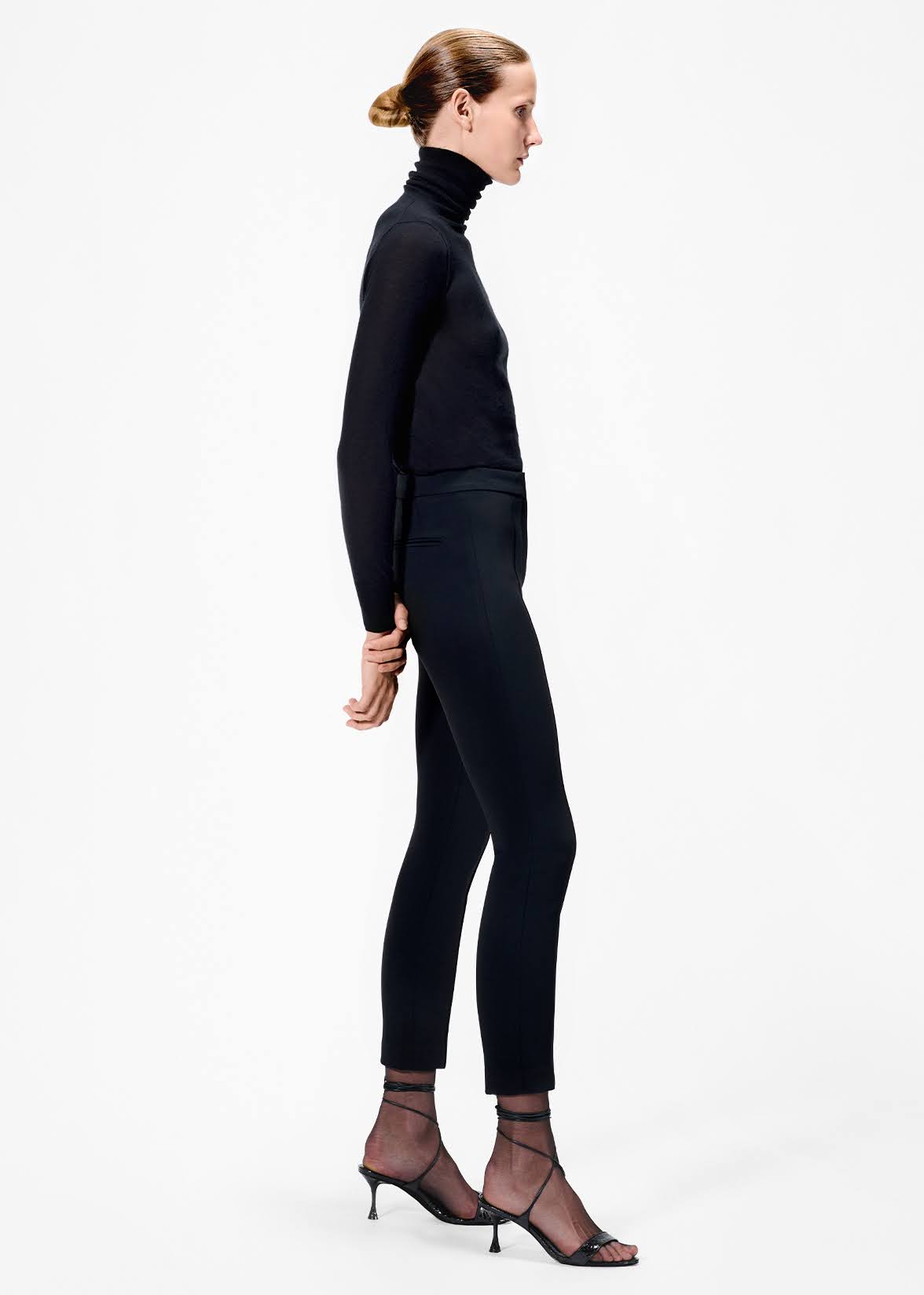 model wearing the cigarette pant in stretch cady in black by Adam Lippes