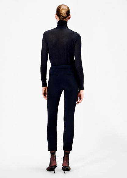 back of model wearing the cigarette pant in stretch cady in black by Adam Lippes