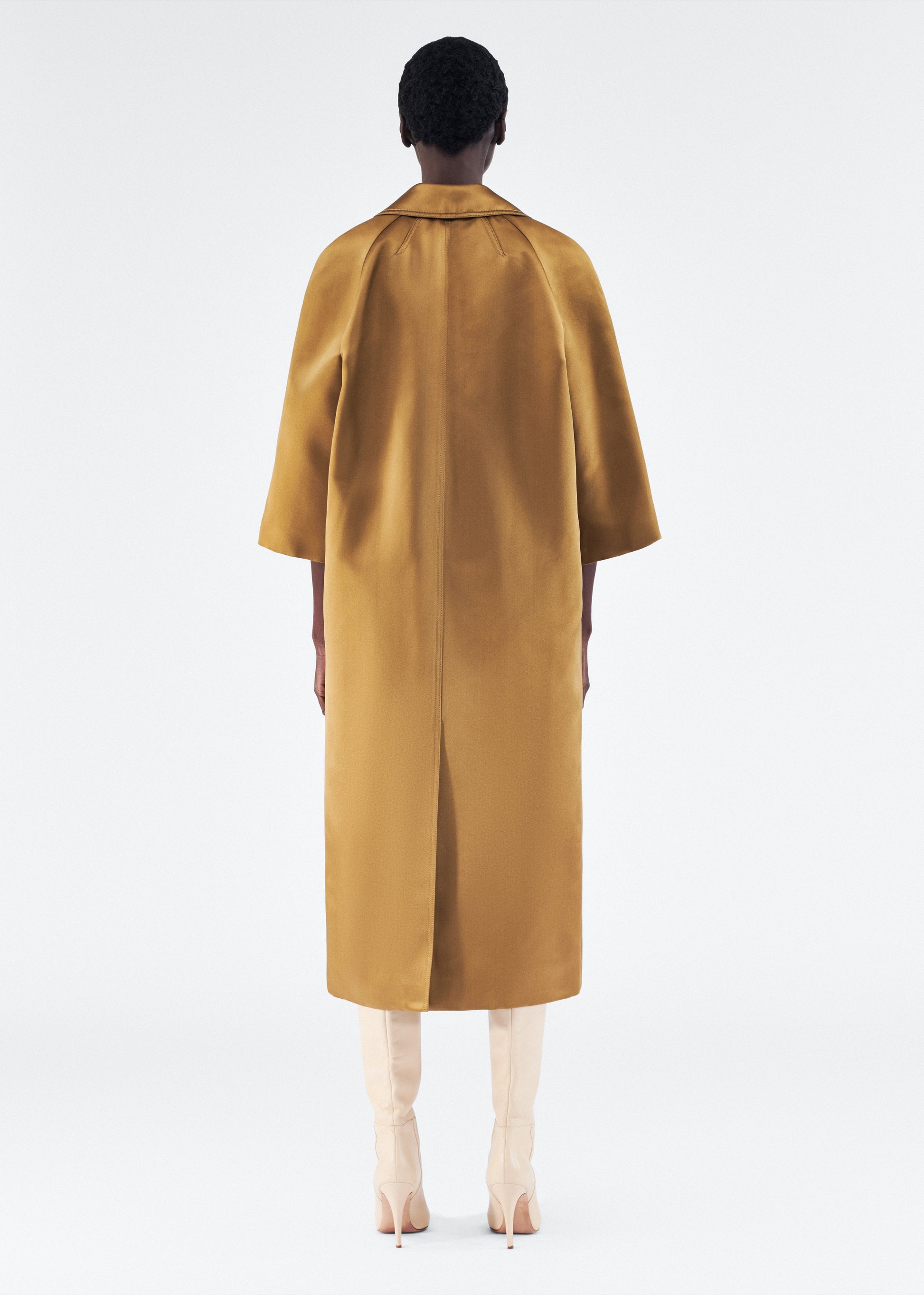 Model is wearing Opera Coat in Duchess Satin in Bronze 