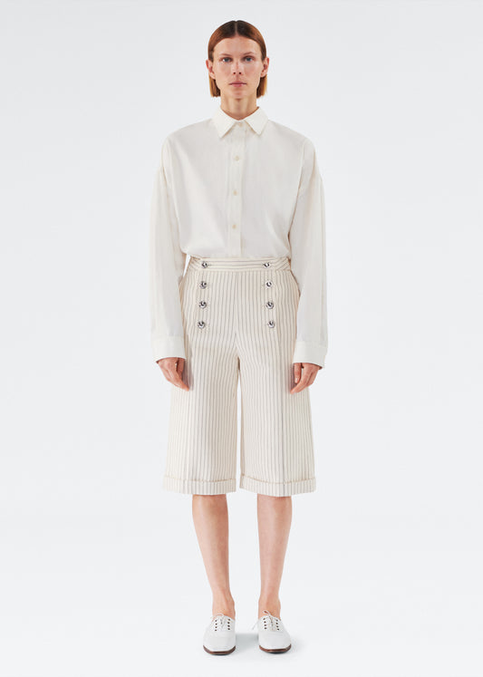 Front of model wearing the Devon Short in Pinstripe Twill in Canvas/Indigo