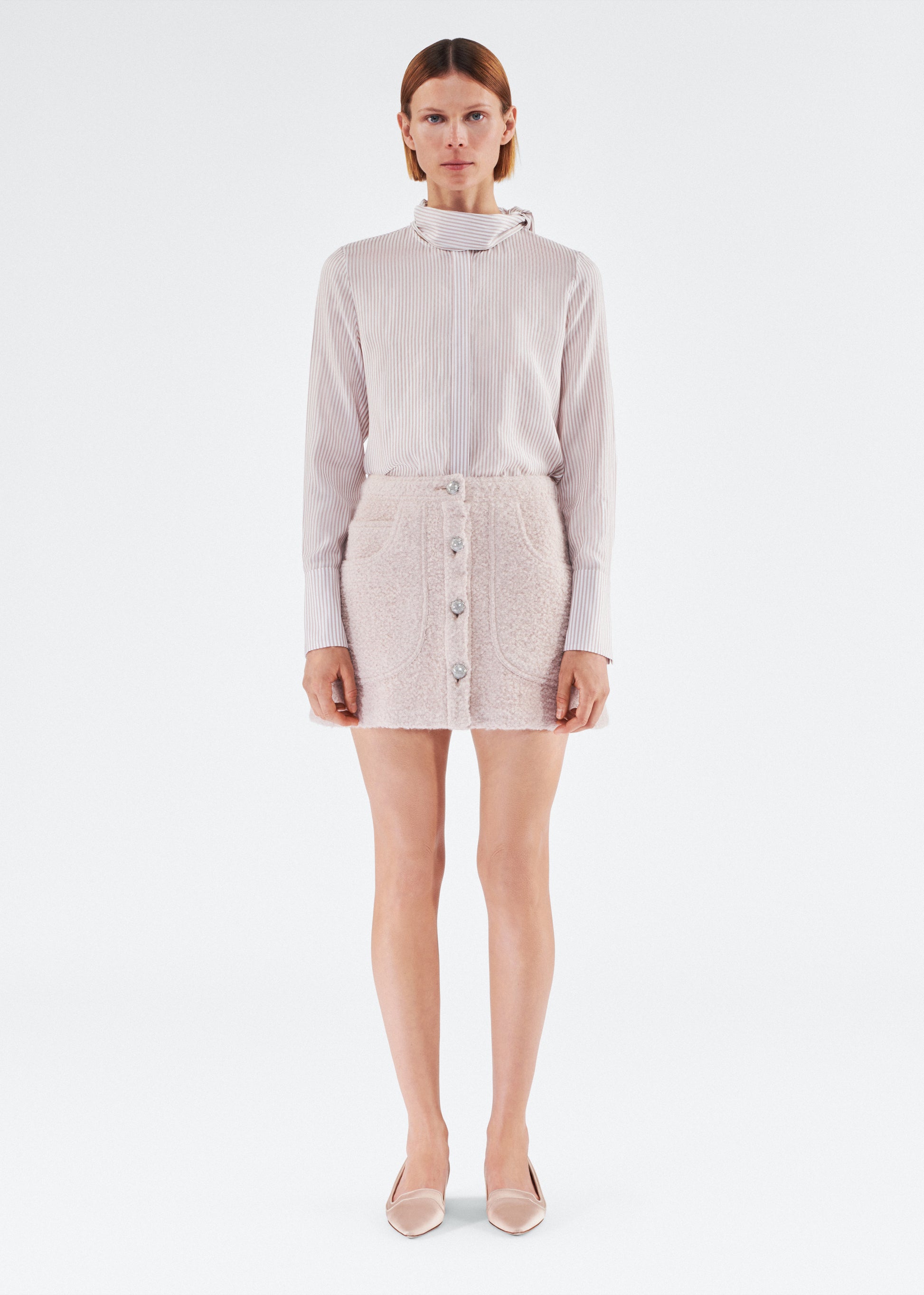 Front of model wearing the Maisey Skirt in Brushed Boucle in Blush