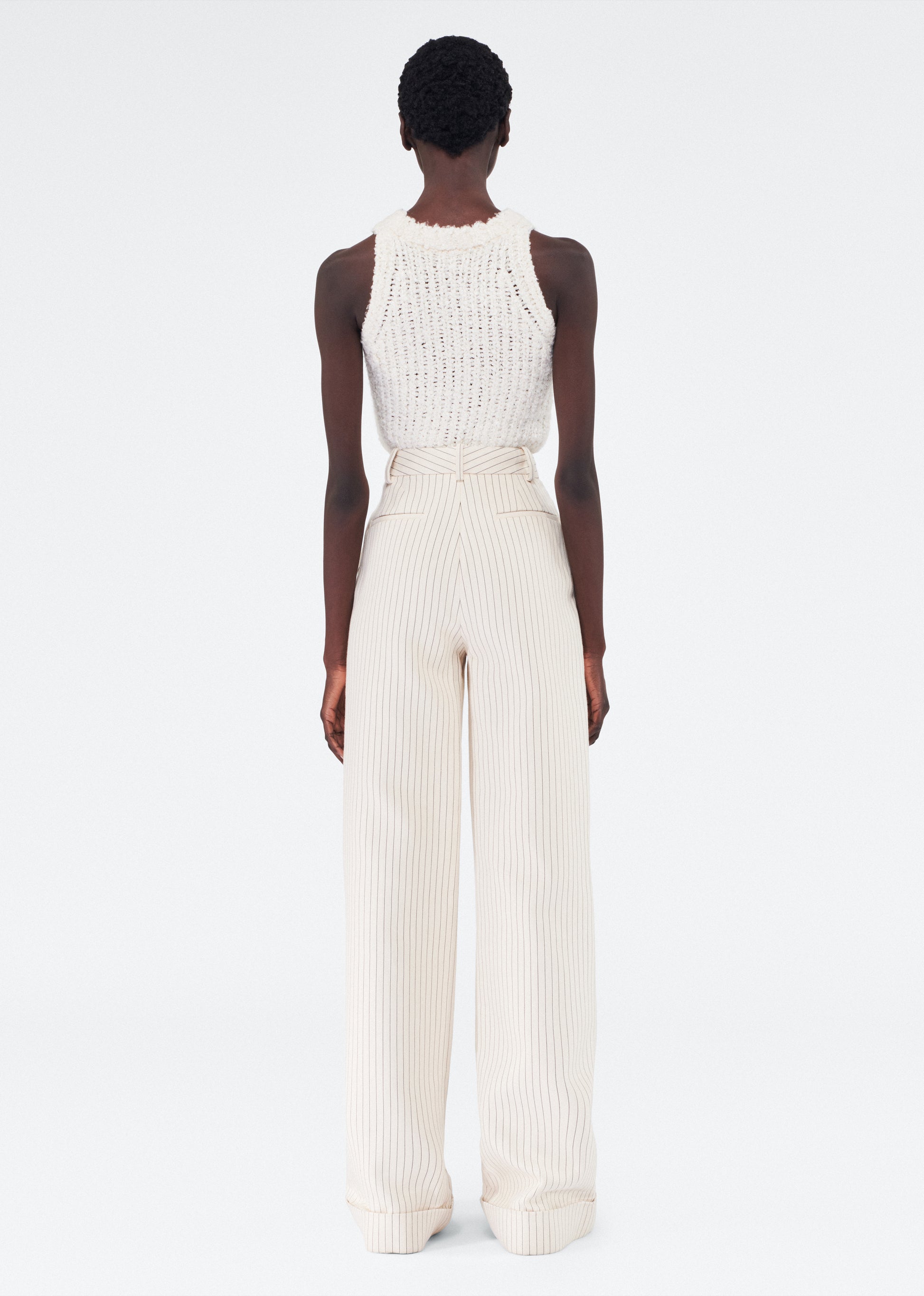 Back of model wearing the Deeda Pant in Pinstripe Twill in Canvas/Indigo