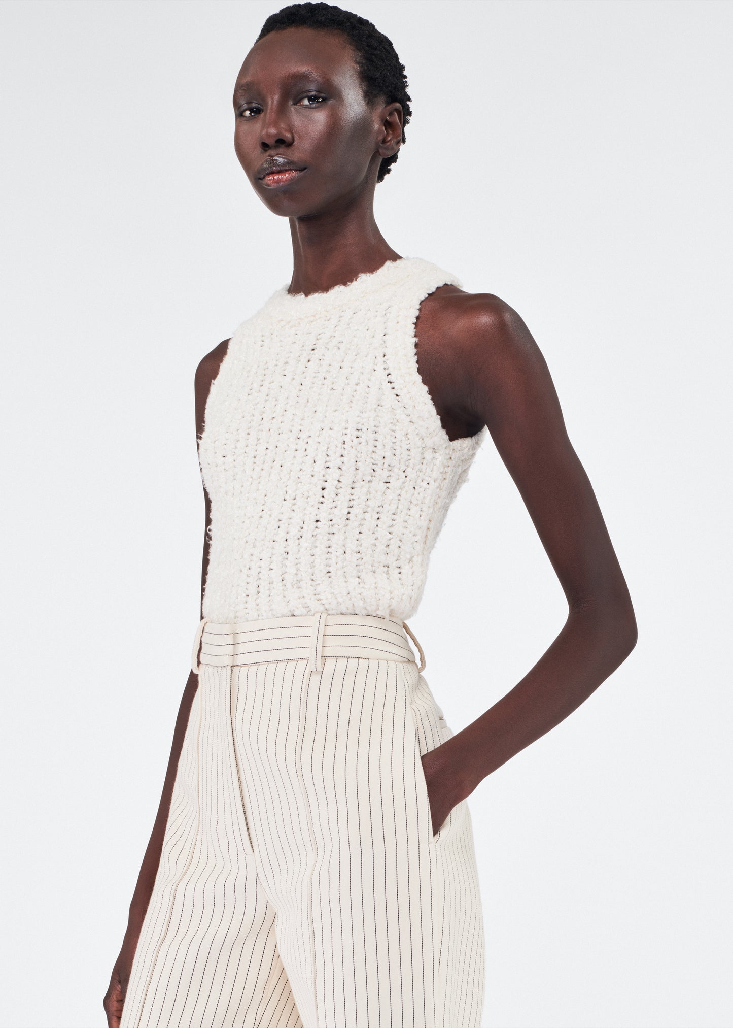 Close up of model wearing the Deeda Pant in Pinstripe Twill in Canvas/Indigo