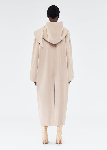back view of model wearing gesse coat by adam lippes in cotton twill in khaki