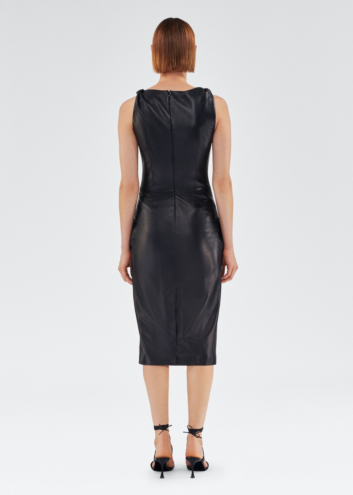 Back of model wearing the Hailee Dress in Leather in Black