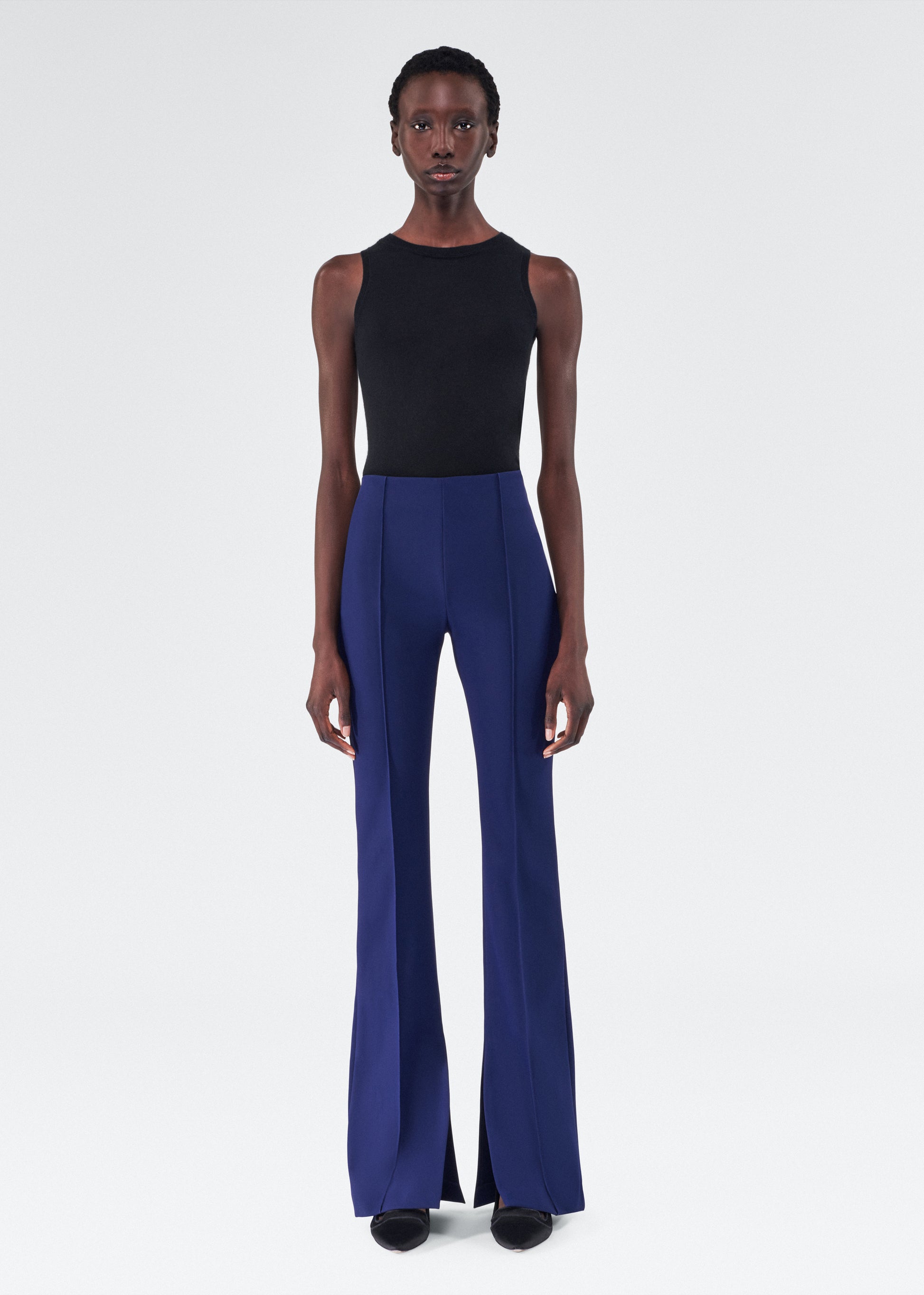 model wearing the adam lippes eva flare pant in navy
