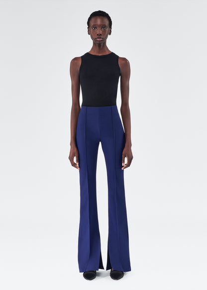 model wearing the adam lippes eva flare pant in navy