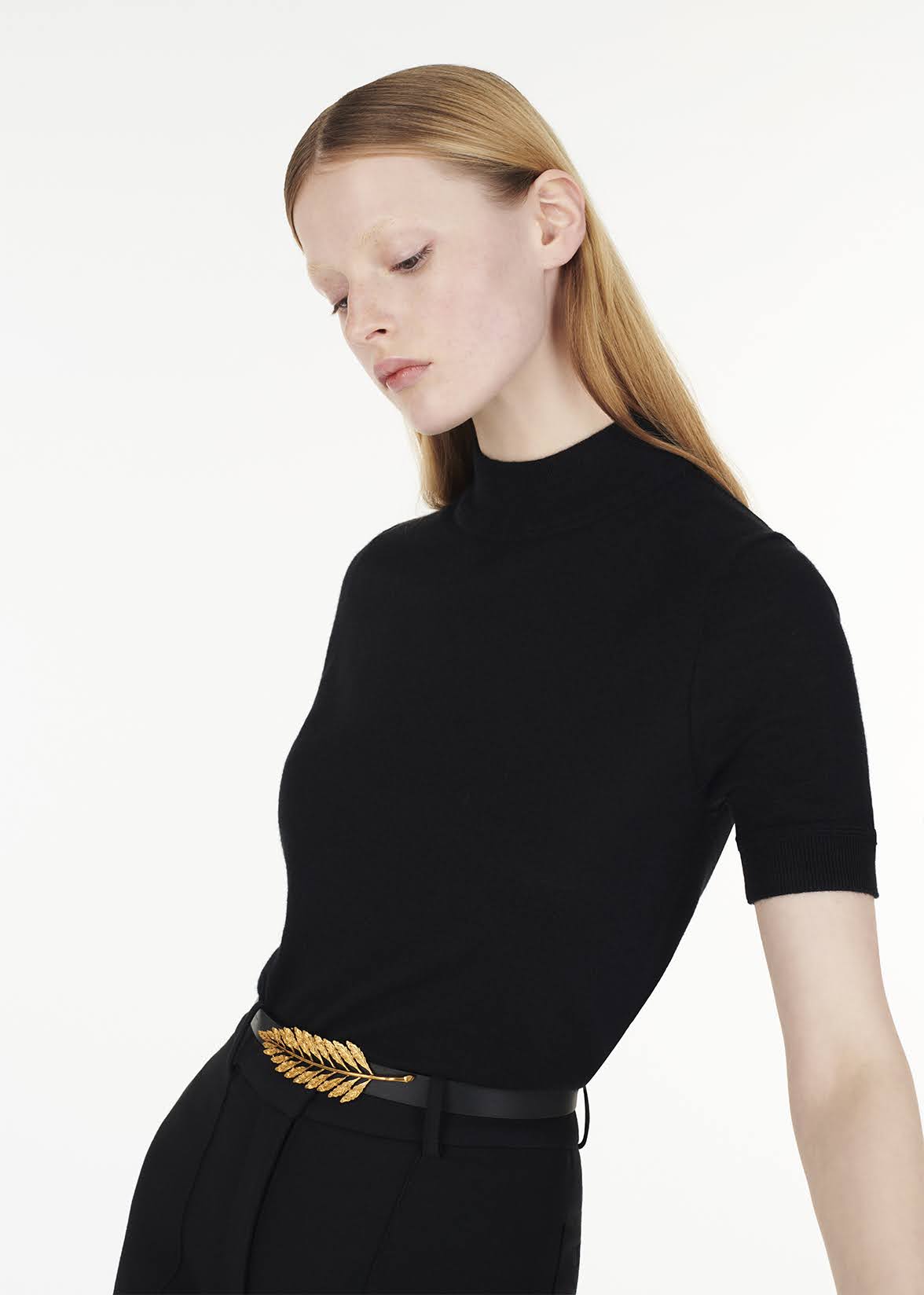 close up front image of model wearign the mockneck top in ultra fine cashmere in black by Adam Lippes