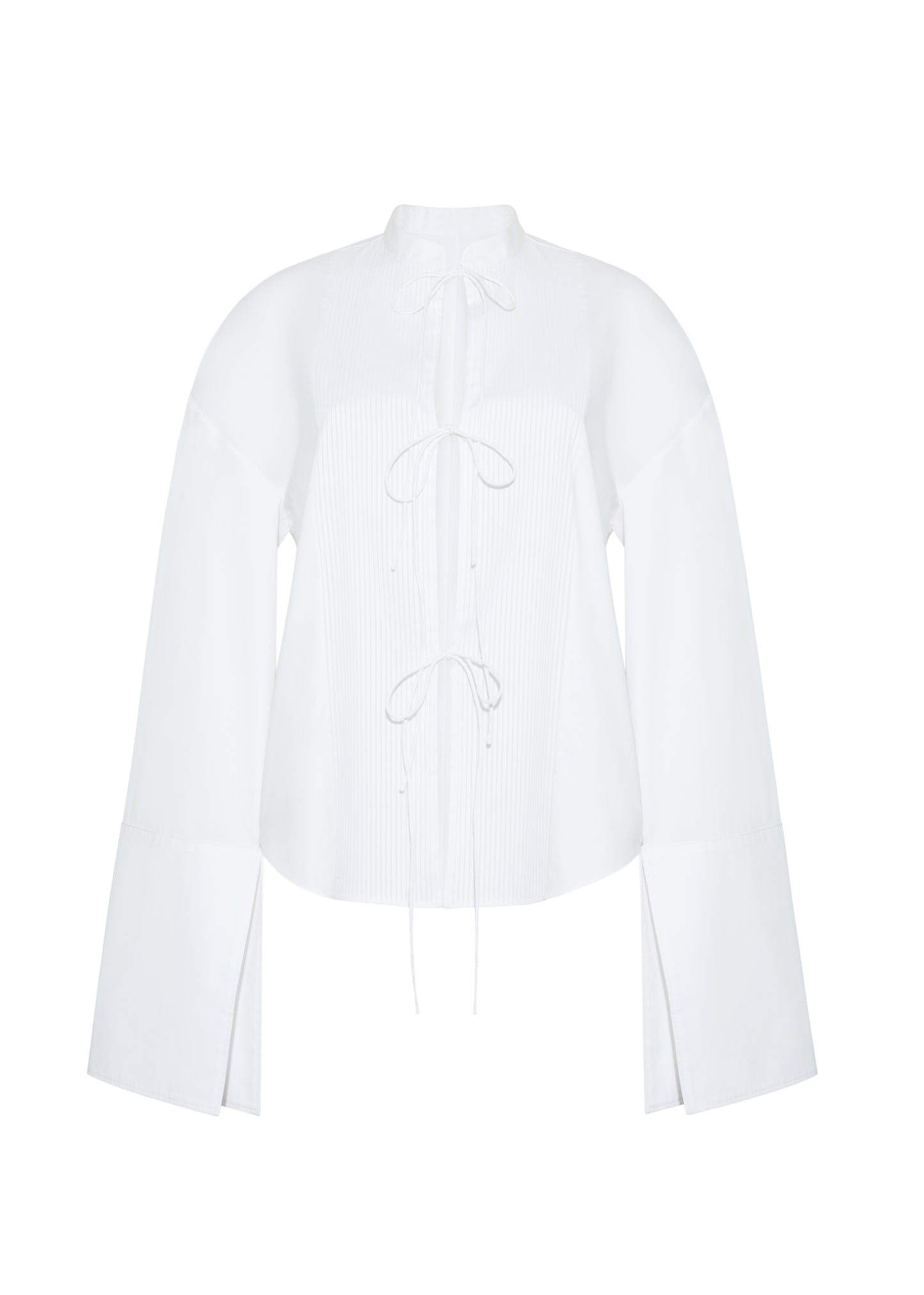 ghost image front – mick top, P25145CS, white – Adam Lippes, P25 collection: A new shape for the season, the Mick Top is crafted from crisp organic cotton poplin in classic white. The top features a tie closure at the center front, adding a subtle touch of modern sophistication. Billowy sleeves with split cuffs create an airy and elegant silhouette. Includes a silk cami for added comfort and versatility.