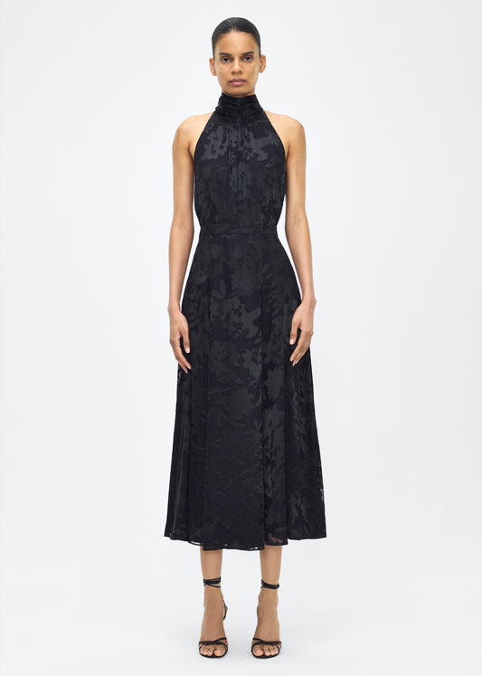 model image facing front– Emi Skirt, P25410DV, Black – Adam Lippes, P25 collection: The Emi Skirt is crafted from elegant burn-out fabric, and features an intricate floral design. The classic black hue, paired with the floral pattern, creates a striking yet sophisticated look. Pair with the Giulia Top for a coordinated ensemble.
