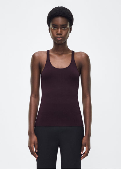 Image of model facing front – lumii tank , P25601VI, cacao – Adam Lippes, P25 collection: A new silhouette from the atelier, the Lumii Tank is crafted from luxurious knitted viscose. Clean lines and athletic-inspired straps make it a versatile piece for layering or wearing alone.