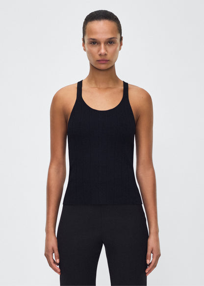 Image of model facing front– lumii tank , P25624UB, black – Adam Lippes, P25 collection: A new silhouette from the atelier, the Lumii Tank is crafted from structured compact jacquard. Clean lines and athletic-inspired straps make it a versatile piece for layering or wearing alone.