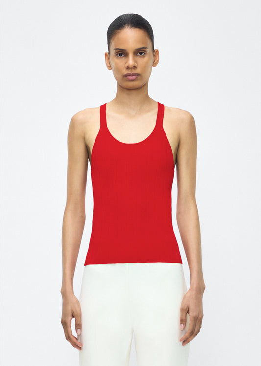 Model facing front – lumii tank , P25624UB, poppy – Adam Lippes, P25 collection: A new silhouette from the atelier, the Lumii Tank is crafted from structured compact jacquard. Clean lines and athletic-inspired straps make it a versatile piece for layering or wearing alone.