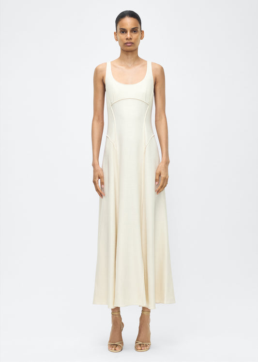 Model facing front, P25718TR, Shay Dress in Ivory, Crafted from versatile stretch canvas, the Shay dress features a structured silhouette with a softly contoured waistline and fluid, voluminous skirt. A scoop neckline and tailored side seams create an elongating effect.
