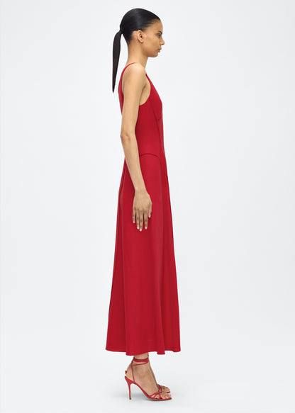 Model facing side, P25718TR, Shay Dress in Poppy, Crafted from versatile stretch canvas, the Shay dress features a structured silhouette with a softly contoured waistline and fluid, voluminous skirt. A scoop neckline and tailored side seams create an elongating effect.