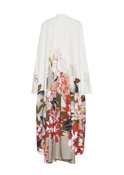 Ghost image back, P25726PV,  Rysa Caftan, Champagne/Multi, Adam Lippes P25 Collection; A new shape from the atelier, the Rysa Caftan is crafted from airy printed voile, featuring this season’s Sicily-inspired floral motif. The fluid hem adds a modern twist to the traditional caftan silhouette. With its flowing, relaxed fit, it exudes effortless elegance. Features a button loop closure and diamond monogram mother of pearl buttons.