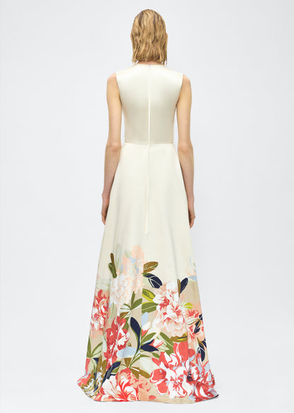 Image of model facing back – Alienor Dress, P25731PU, Champagne/Multi – Adam Lippes, P25 collection: The Alienor Dress in printed duchess satin is defined by its elegant simplicity. Adorned with the Pre-Fall collection’s Sicily-inspired floral motif, it features a classic rounded neckline and flows gracefully for effortless wear.