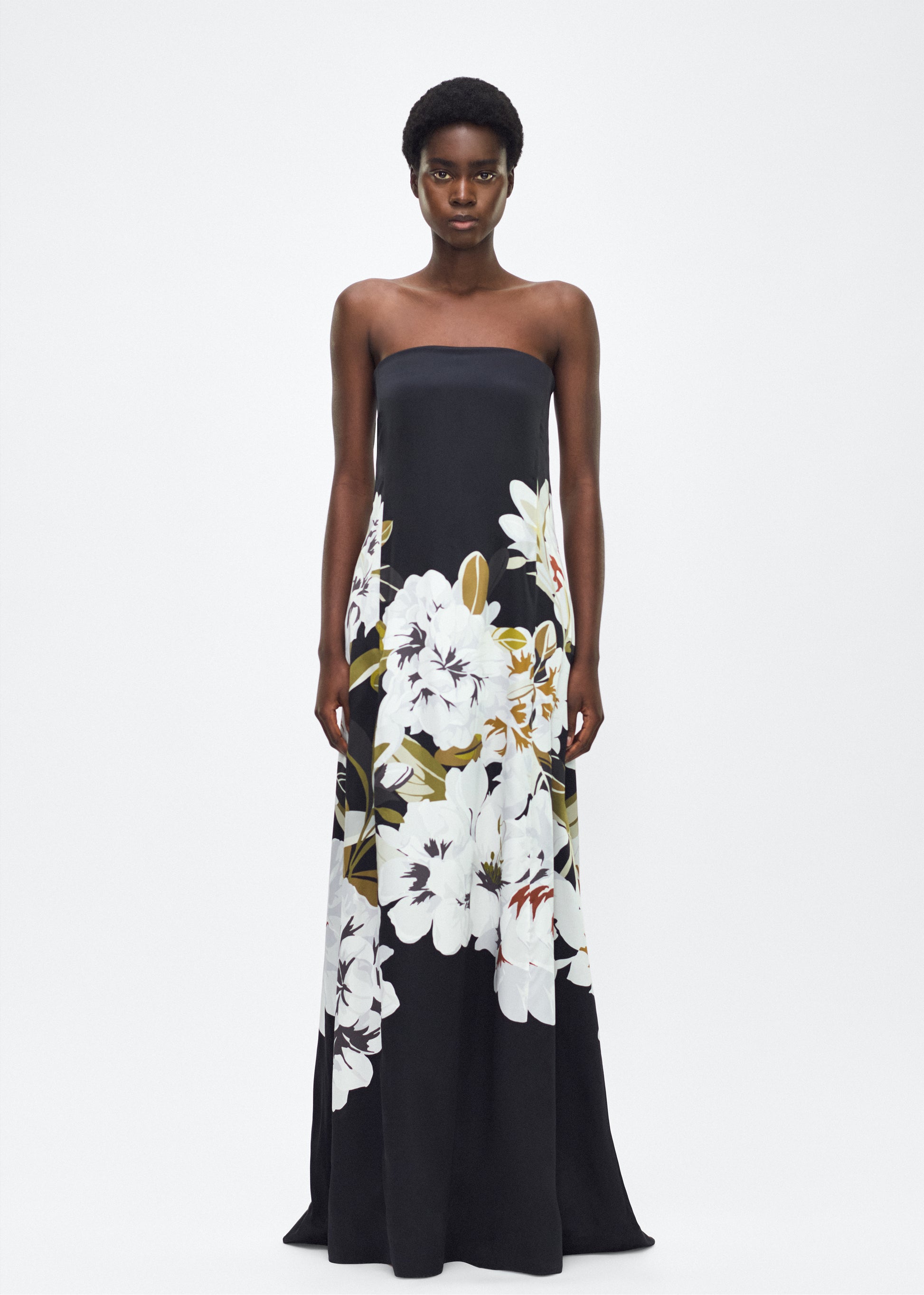 Model facing front, P25761PD, the Marais Dress in Black/white, Adam Lippes P25 Collection, The strapless silhouette of the Marais Dress offers an elegant, flowing shape for formal occasions. Luminous silk is beautifully adorned with this season’s Sicily-inspired floral motif.