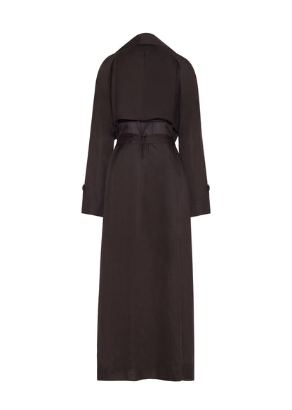 Ghost image back, the Jupiter Trench, P25 Adam Lippes Collection, color Ebony. The Jupiter Trench is crafted from lightweight cotton organdy, offering a semi-sheer, airy feel. Finished with the Adam Lippes diamond motif, embroidered in silk charmeuse at the back, and designed with a belt to cinch the waist, creating a sleek silhouette with considered details.