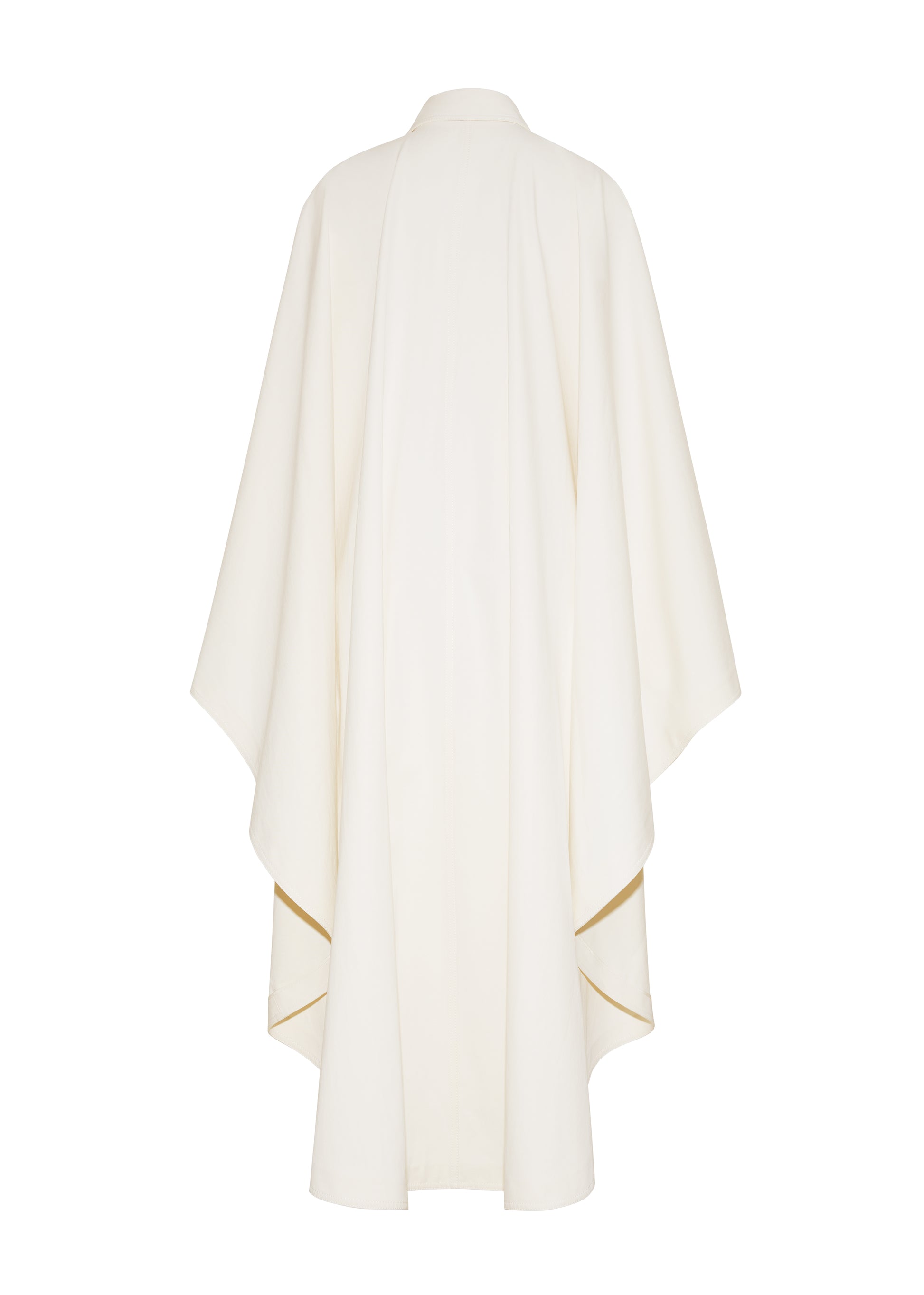 Ghost image back, The Langston Poncho, P25914CT, in color ivory, Adam Lippes P25 collection; The Langston Poncho in ivory cotton twill offers an elegant take on the classic poncho. With its modern, relaxed shape, sharp tailoring, and hidden corozo button closure down the center front, it effortlessly elevates any ensemble. The ivory hue and clean lines are complemented by thoughtful details.