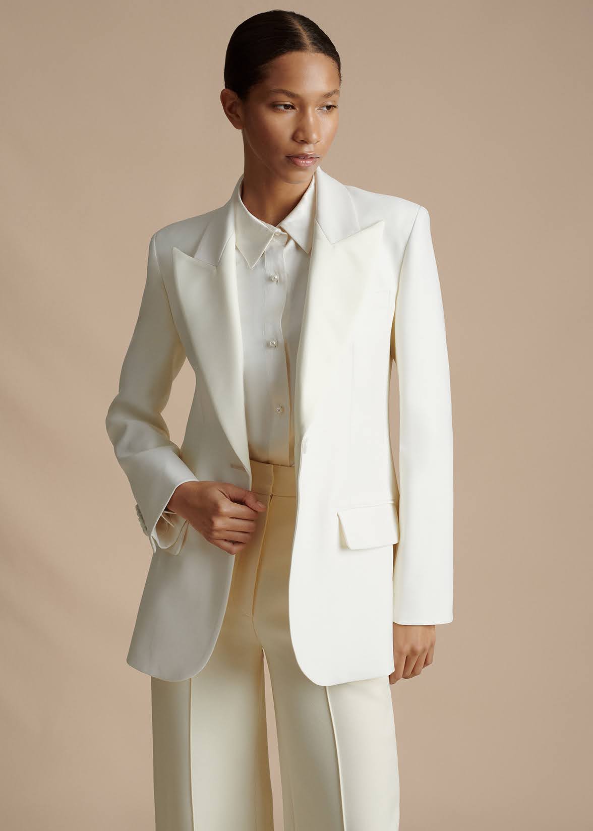 close up front facing image model wearing the the tux jacket in radzimir wool in ivory by Adam Lippes