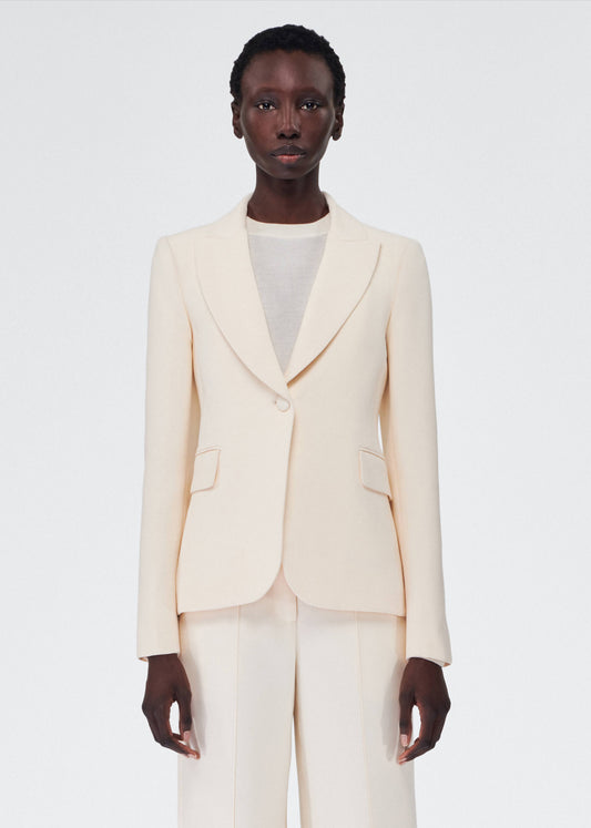 model wearing the adam lippes single breasted blazer in silk wool in ivory