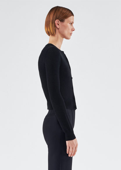 side view of model wearing the adam lippes cardigan in cashmere silk in black
