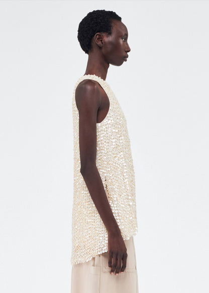Side View of model wearing the Rami Top in Embroidered Mother of Pearl