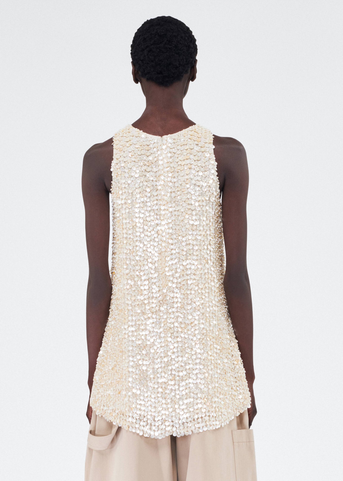 Back of model wearing the Rami Top in Embroidered Mother of Pearl