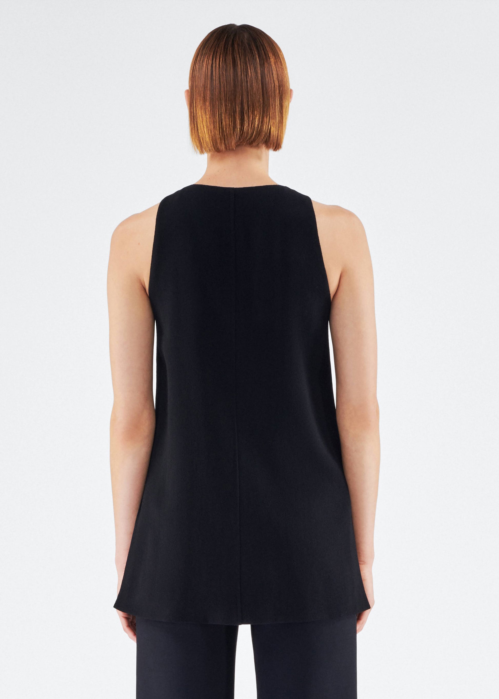 Back of model wearing the Nazra Tunic in Light Wool Crepe Black