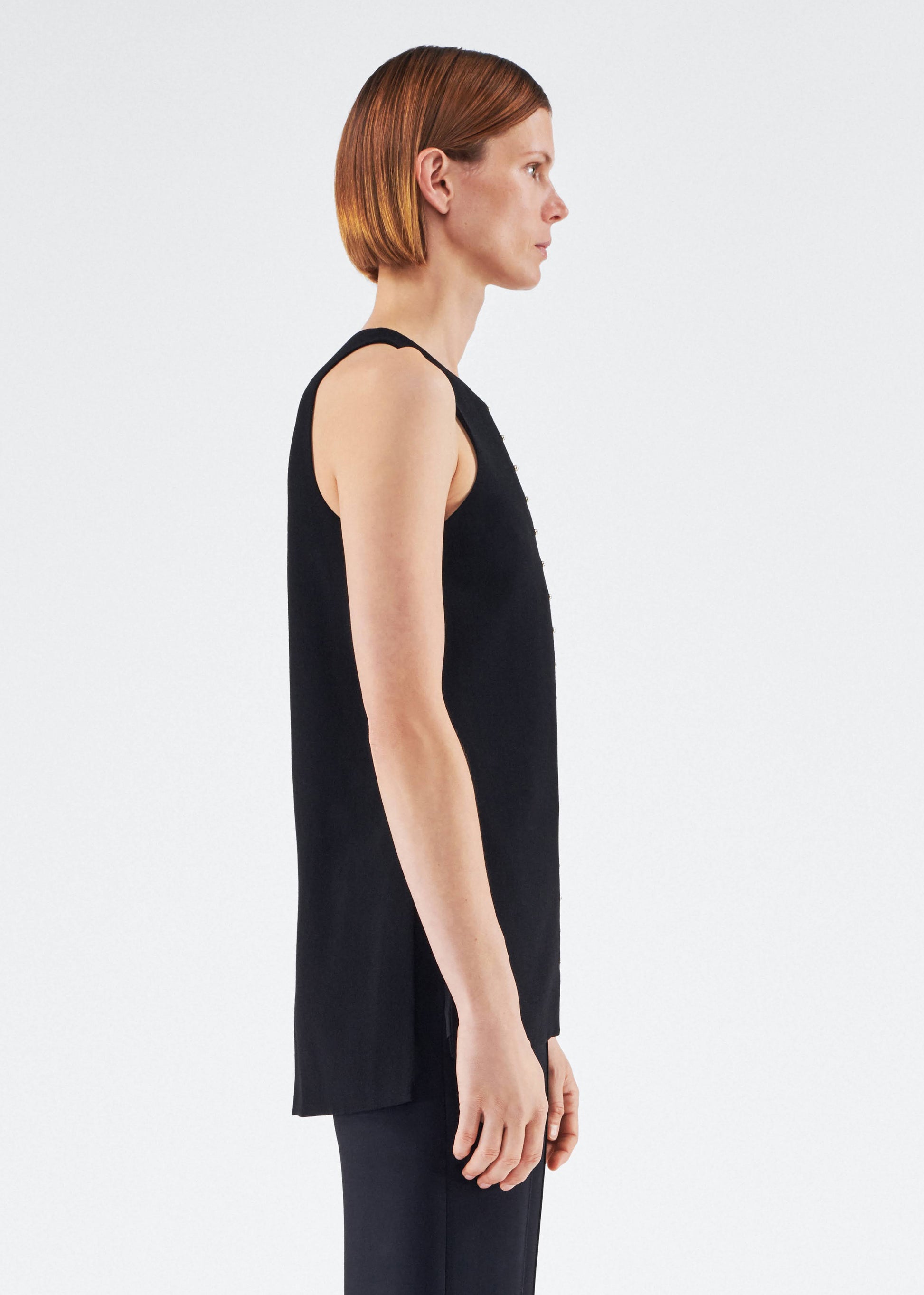 Side View of model wearing the Nazra Tunic in Light Wool Crepe Black