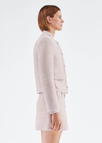 Side View of model wearing the Lana Jacket in Brushed Boucle in Blush