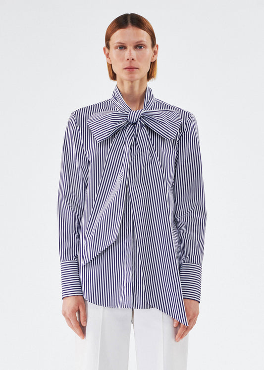 model wearing lee blouse by adam lippes in striped poplin in navy and white
