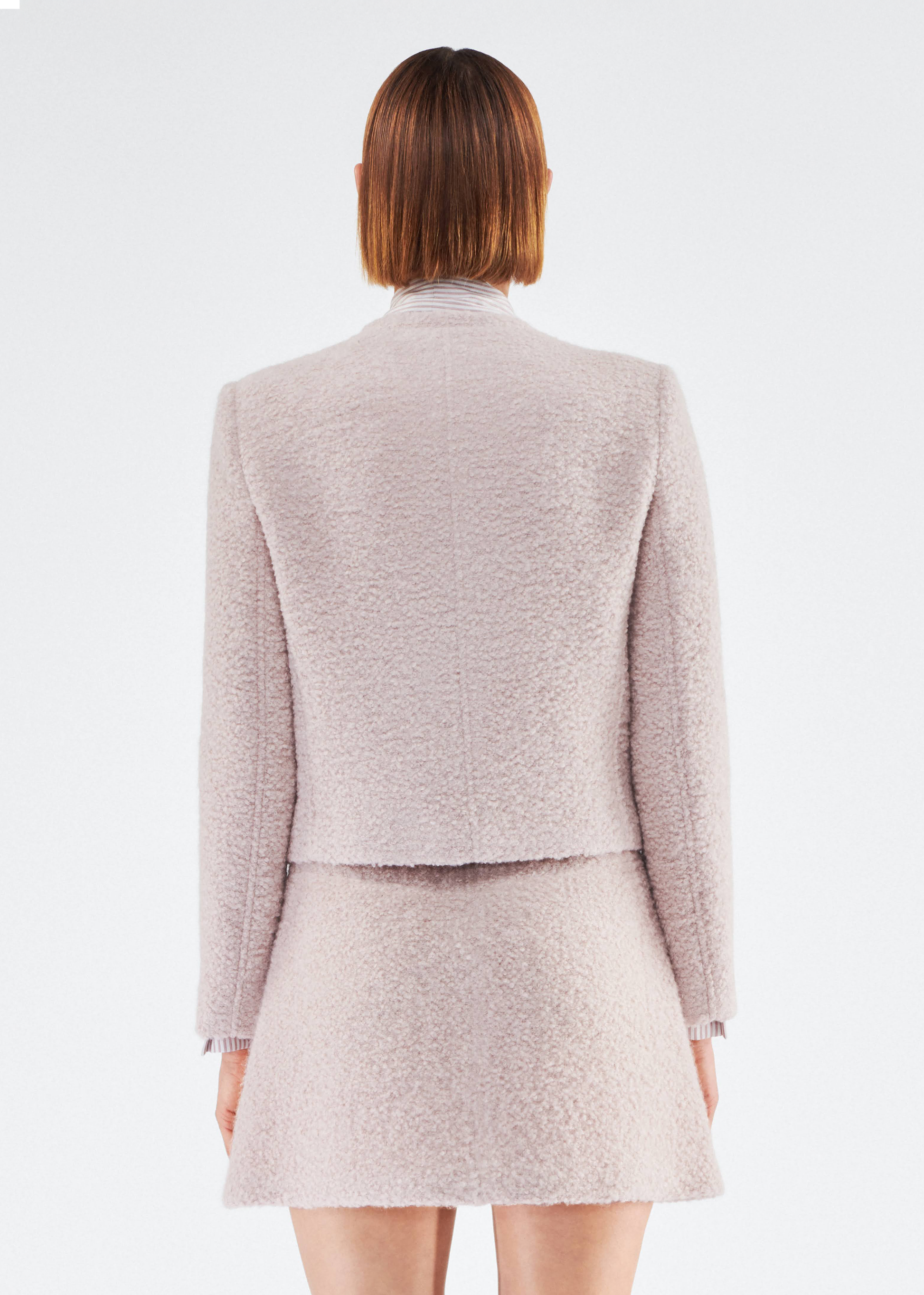 Back of model wearing the Lana Jacket in Brushed Boucle in Blush
