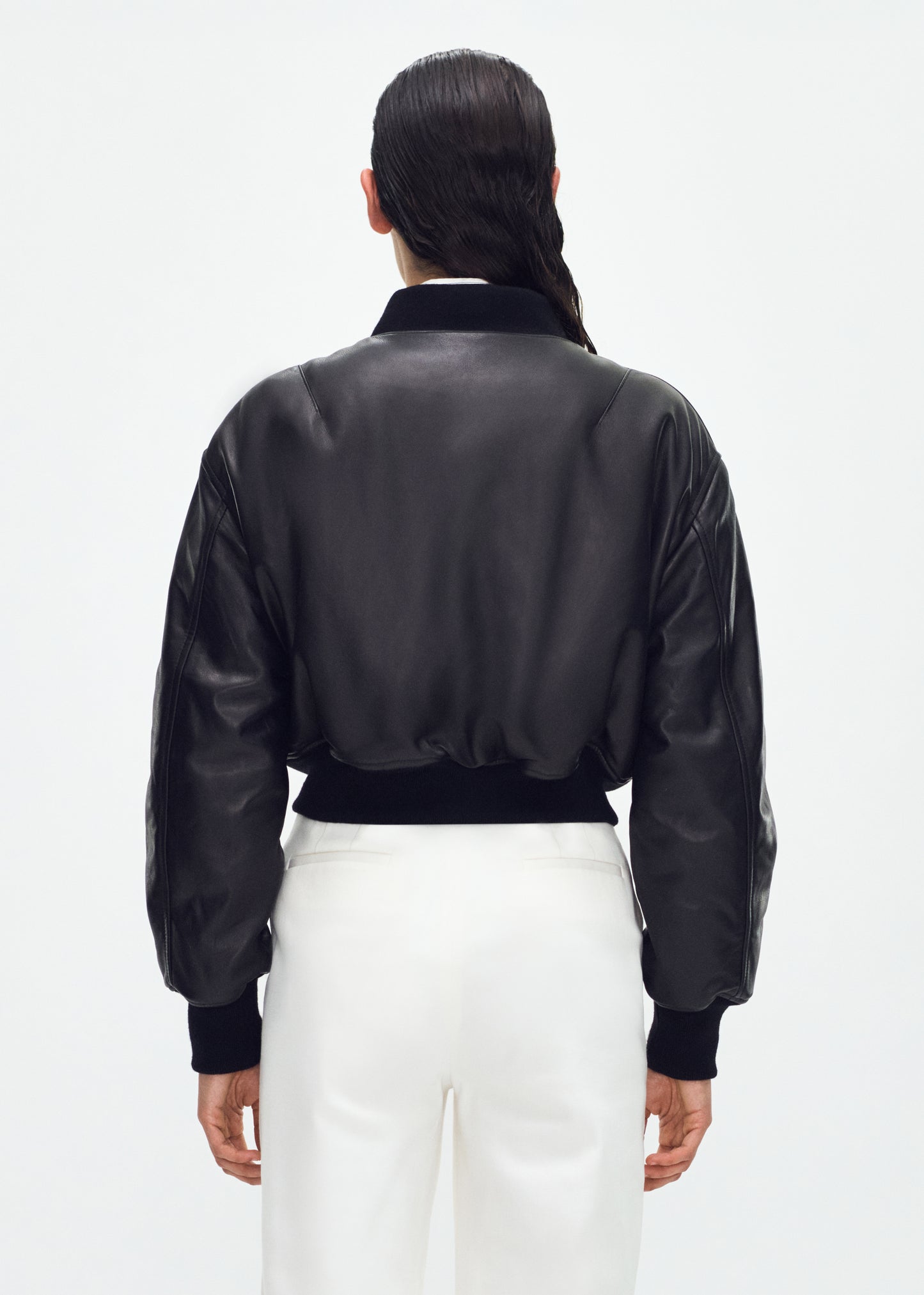 back of model wearing the Bomber Jacket in Black Leather