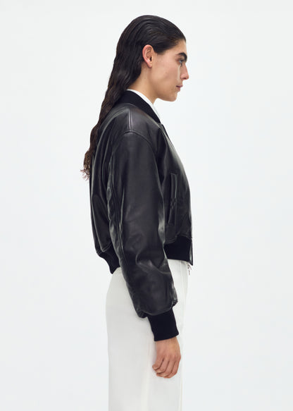 side profile of model wearing the Bomber Jacket in Black Leather