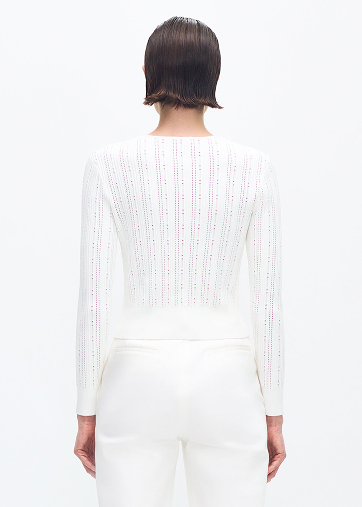 model wearing the adam lippes faye cardigan in ivory