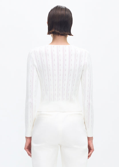 model wearing the adam lippes faye cardigan in ivory