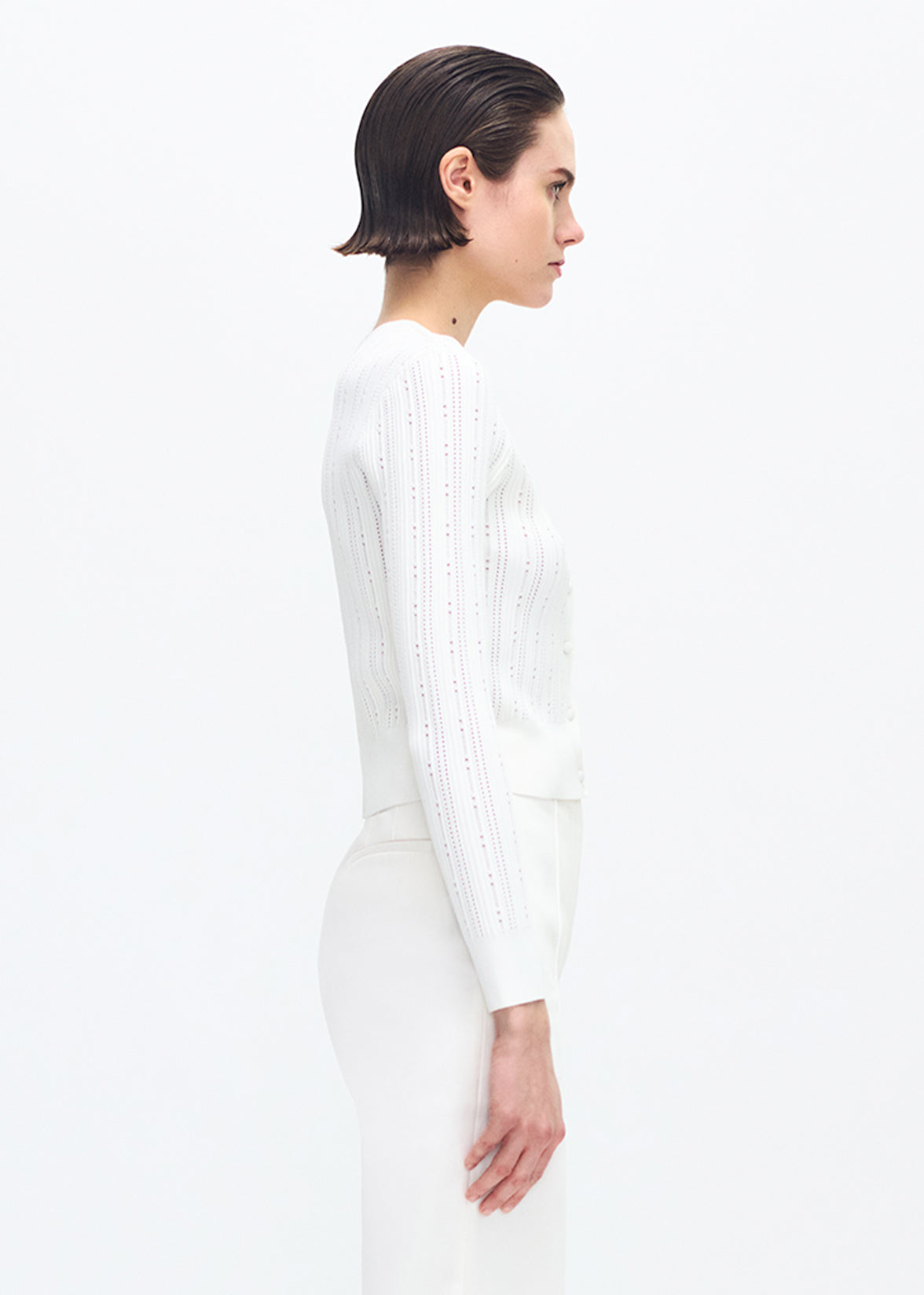 model wearing the adam lippes faye cardigan in ivory